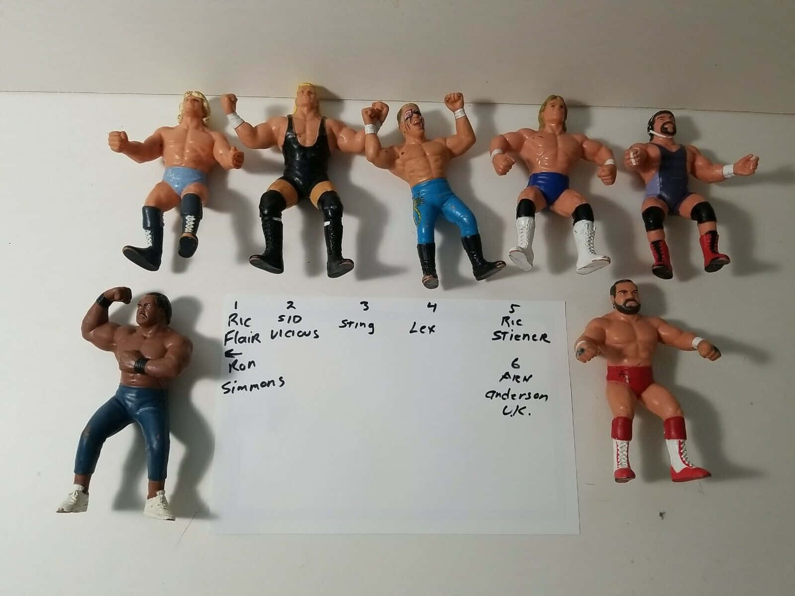 Caption: Legendary Wrestler Arn Anderson With Ringside Collectible Action Figures Wallpaper