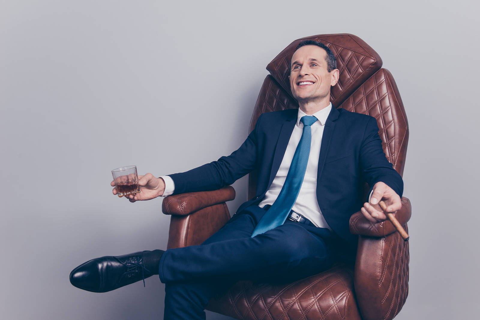 Arrogant Businessman Sitting On Leather Chair Picture
