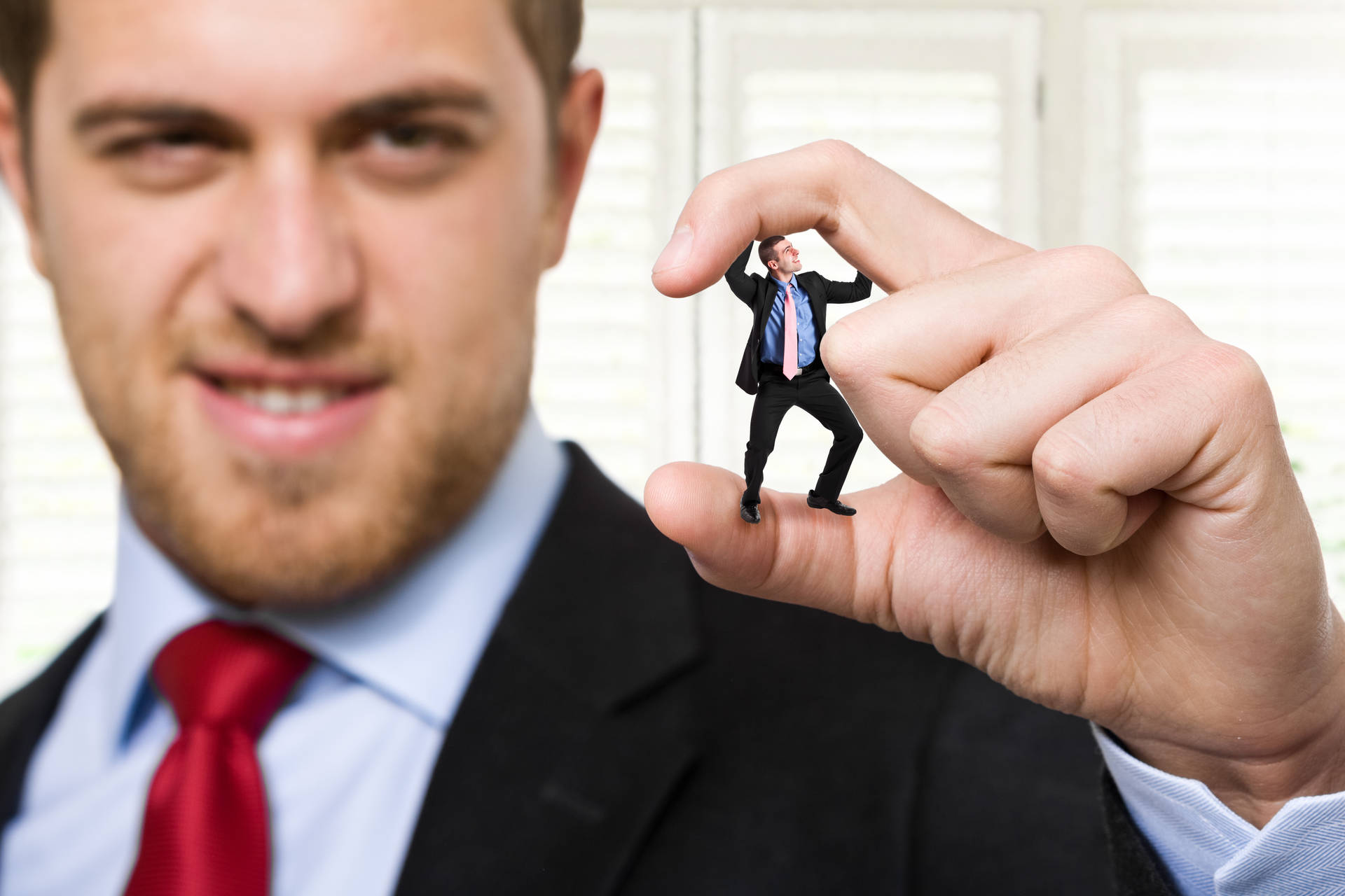 Arrogant Businessman Squishing Tiny Co-worker Picture