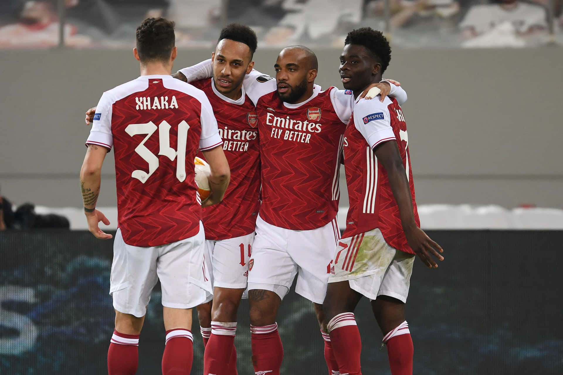 Arsenal players celebrate a goal at Emirates Stadium