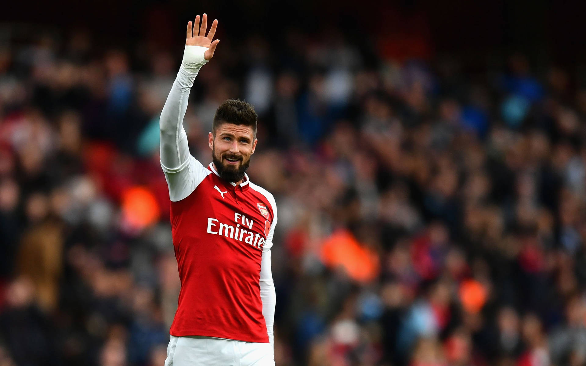 Arsenal FC Player Hand Raise Wallpaper