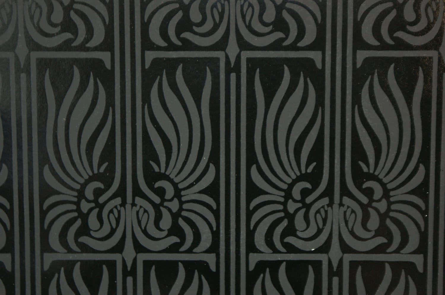 A Black And White Pattern On A Wall