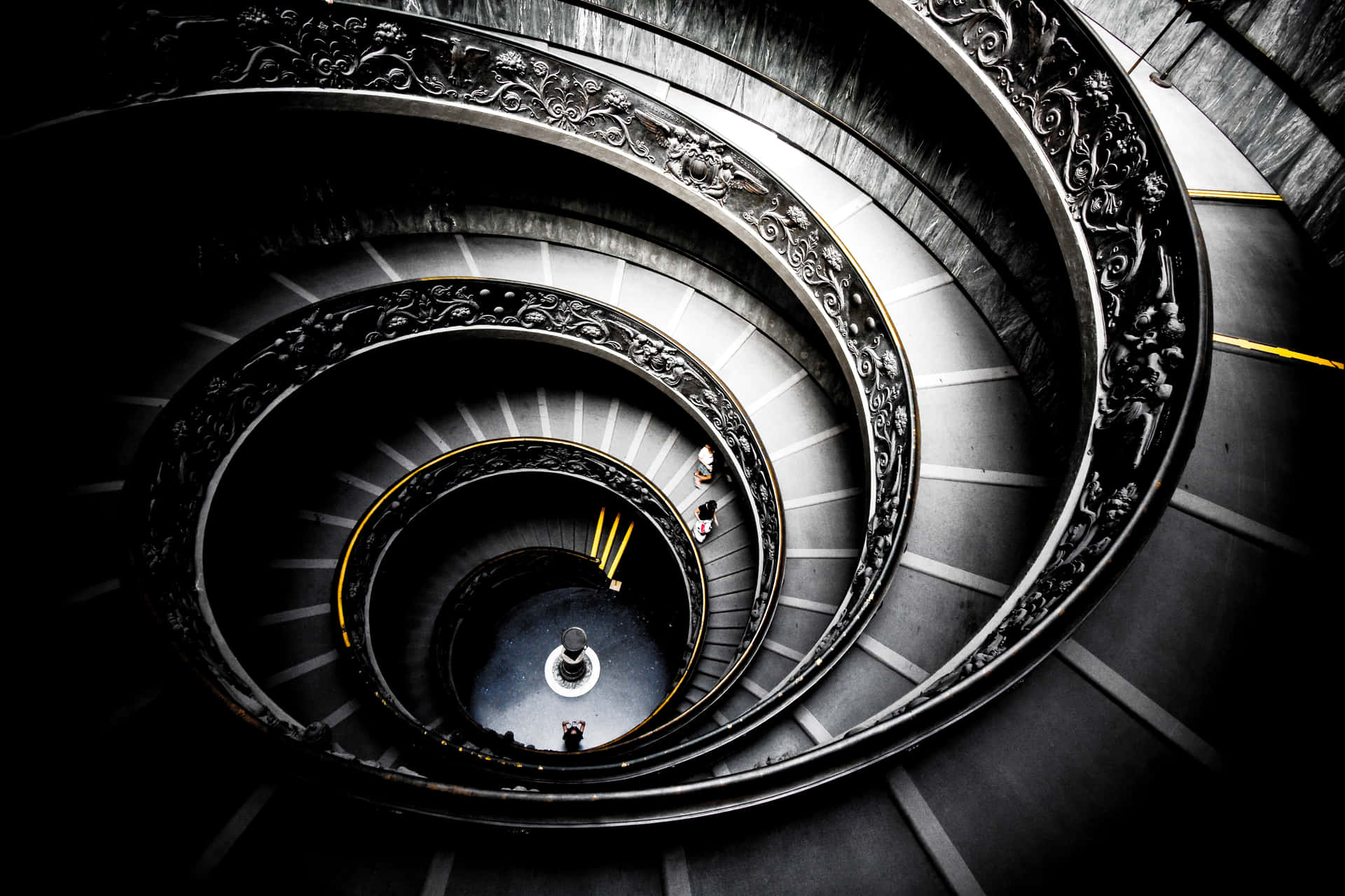 A Spiral Staircase With A Person On It Wallpaper