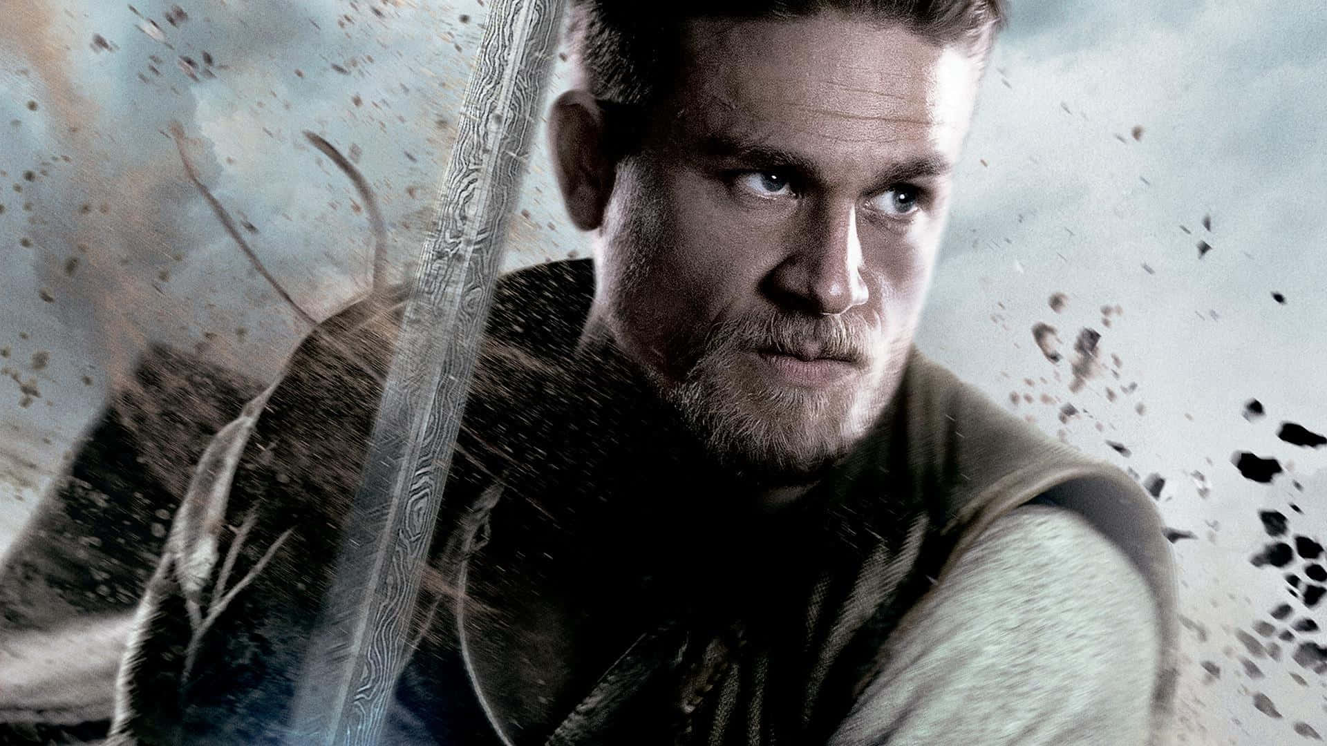A Man Holding A Sword In A Movie Poster