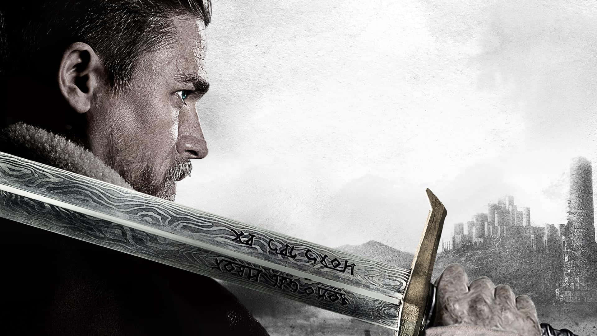 The Hobbit Movie Poster With A Man Holding A Sword