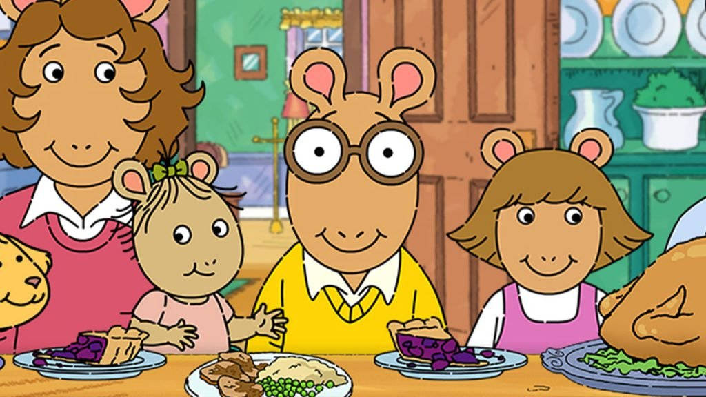 Arthur With Family In Dining Table Background