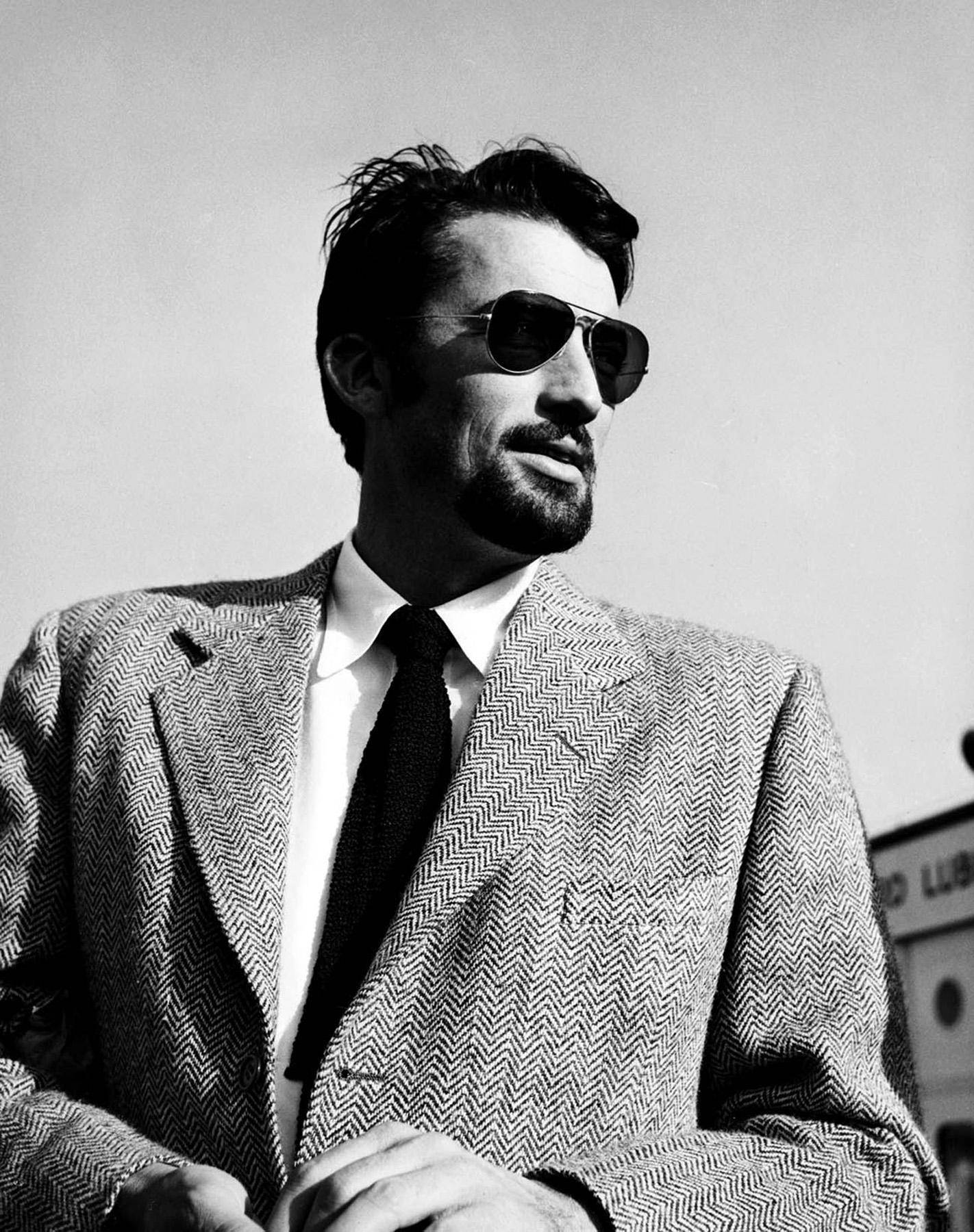 Timeless Elegance - Gregory Peck Wearing Sunglasses Wallpaper