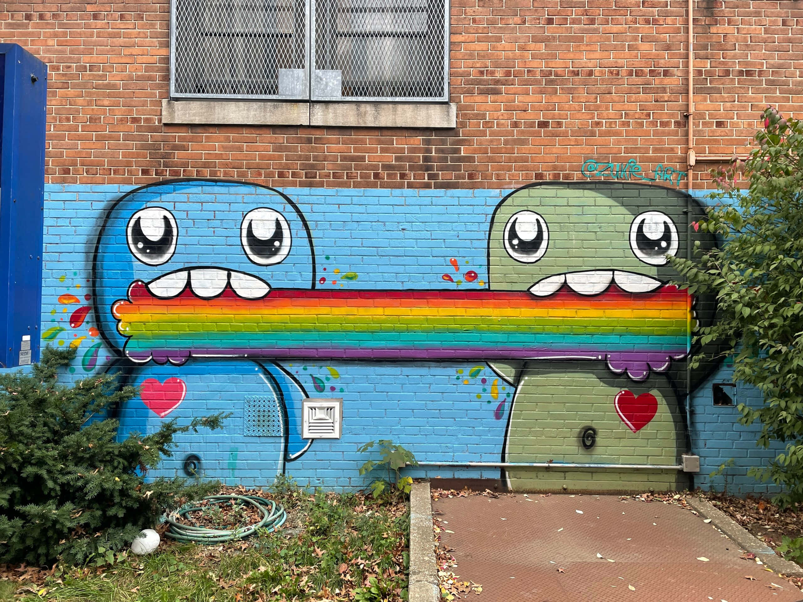 Artistic Splashes- Rainbow Graffiti On Wall Wallpaper