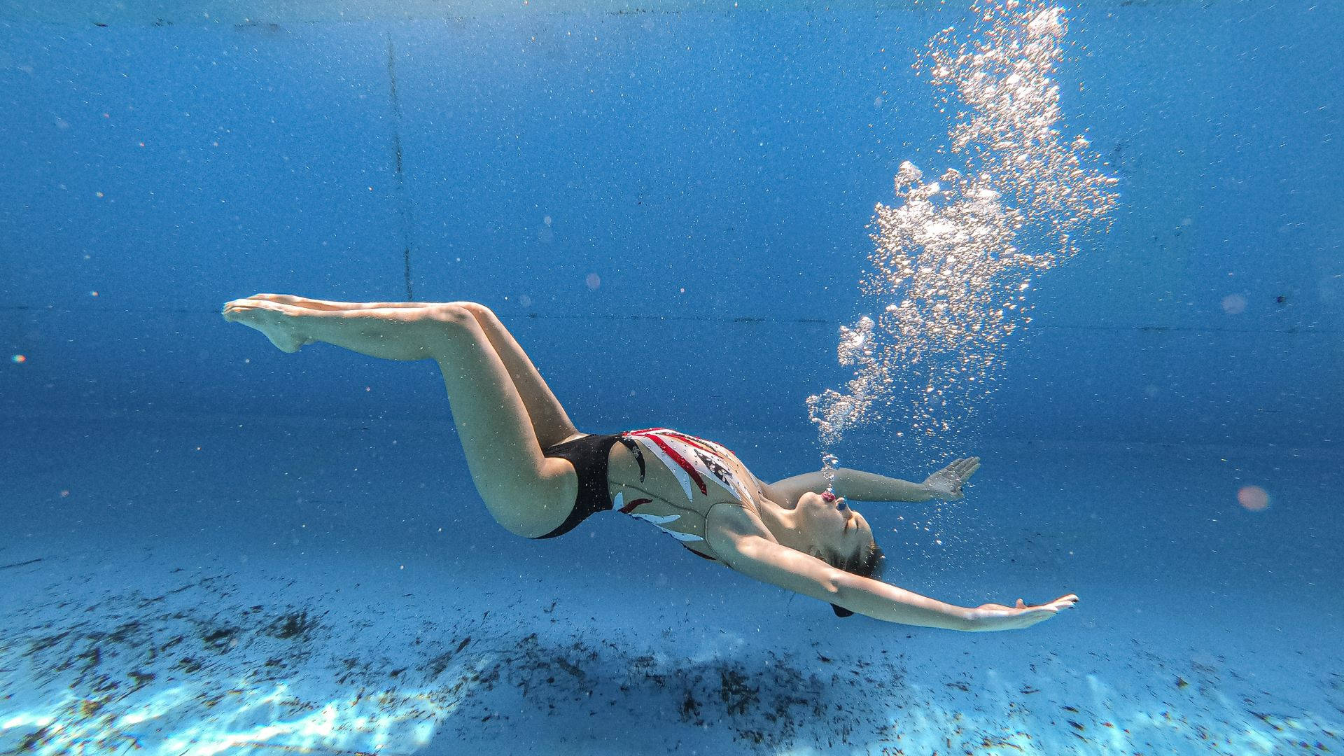 Artistic Swimmer Sinking Down Wallpaper