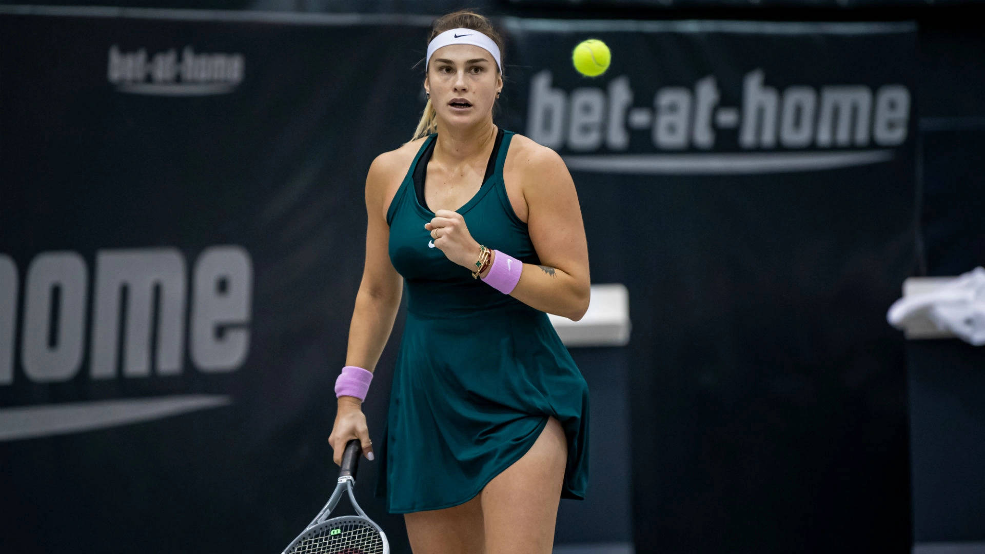 Aryna Sabalenka Approaching Tennis Ball Wallpaper