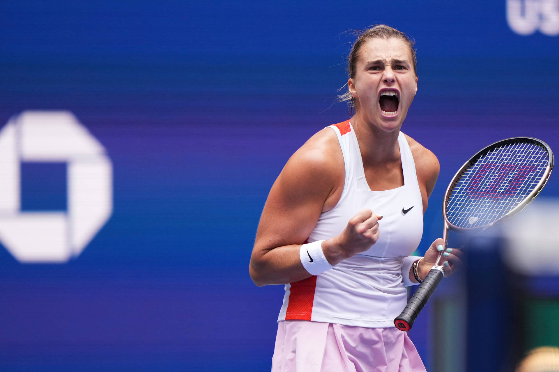 Caption: Aryna Sabalenka expressing intensity on the tennis court. Wallpaper
