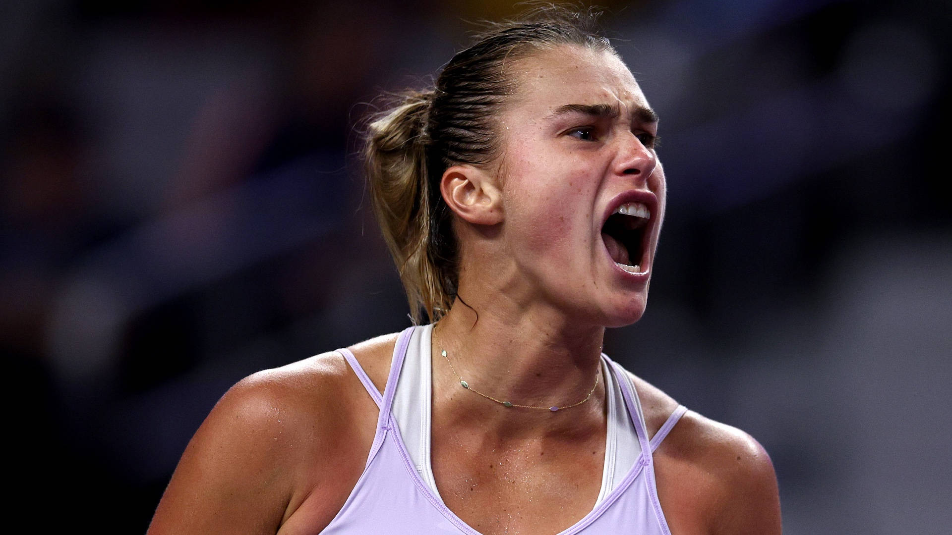 Aryna Sabalenka Expressing Intensity in the Tennis Court Wallpaper