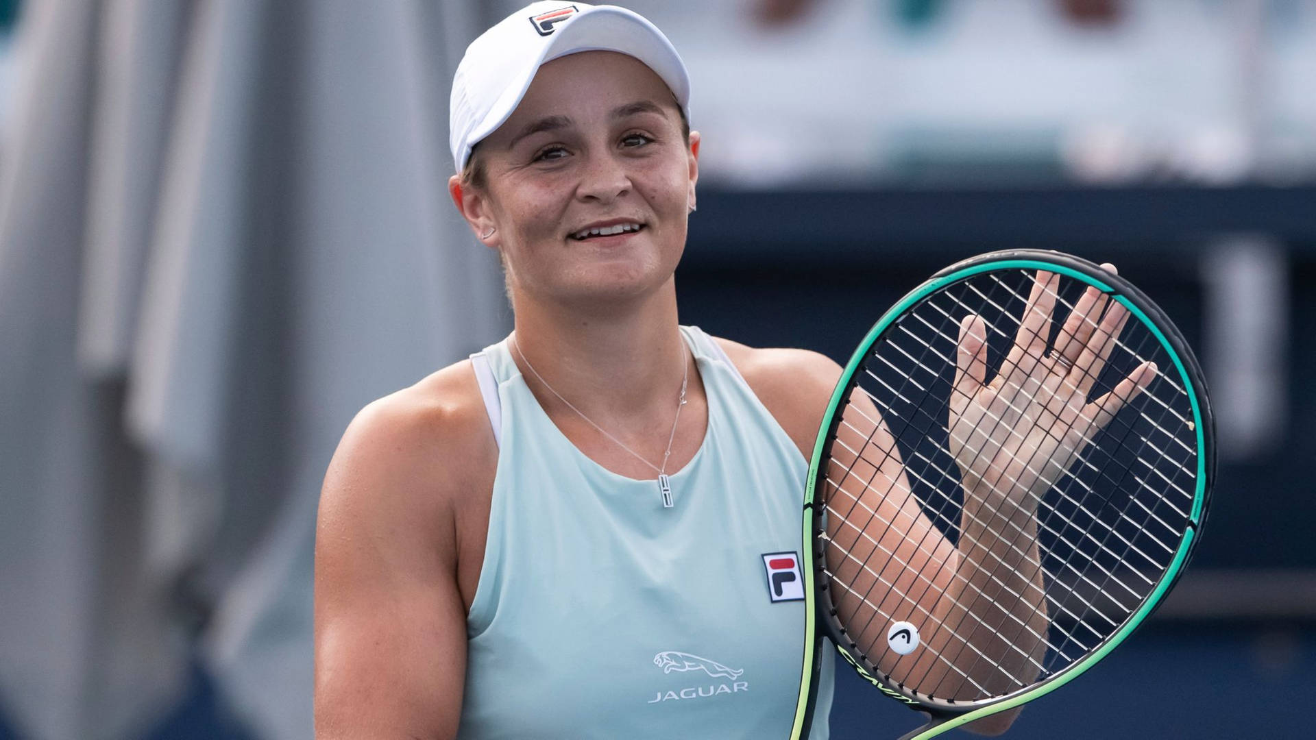 Champion Ashleigh Barty in Action Wallpaper