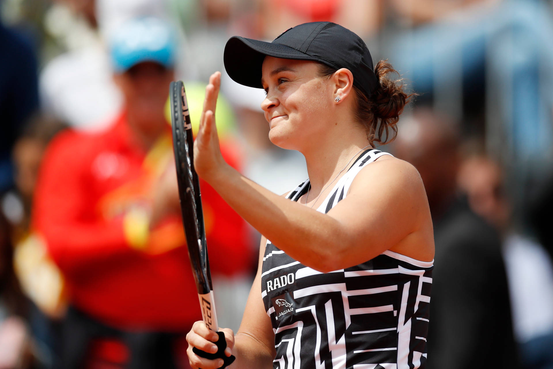 A charismatic close-up of Ashleigh Barty showcasing her dimple Wallpaper