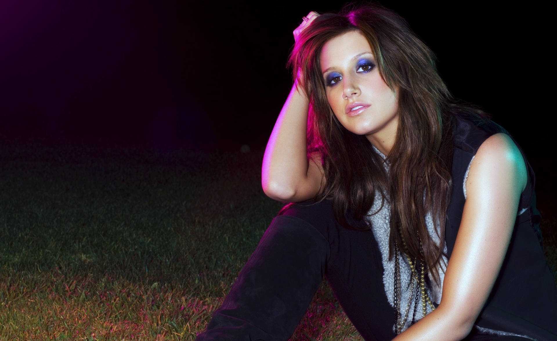 Ashley Tisdale emanates vibrant energy with her dazzling blue eyeshadow. Wallpaper