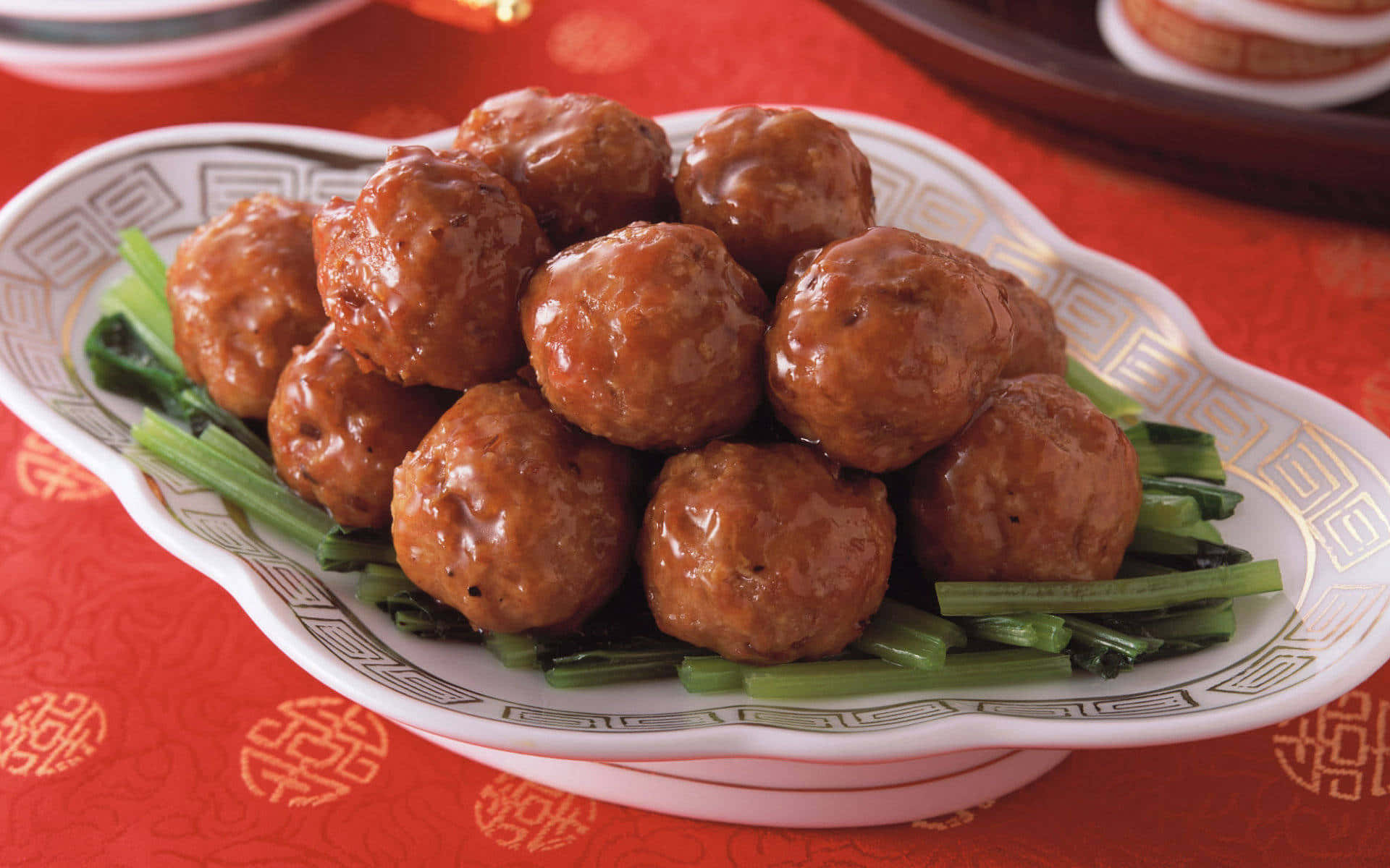 Asian Style Glazed Meatballson Greens Wallpaper