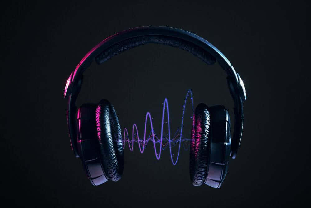 Hovedtelefoner med lydbølger på en sort baggrund. Wallpaper