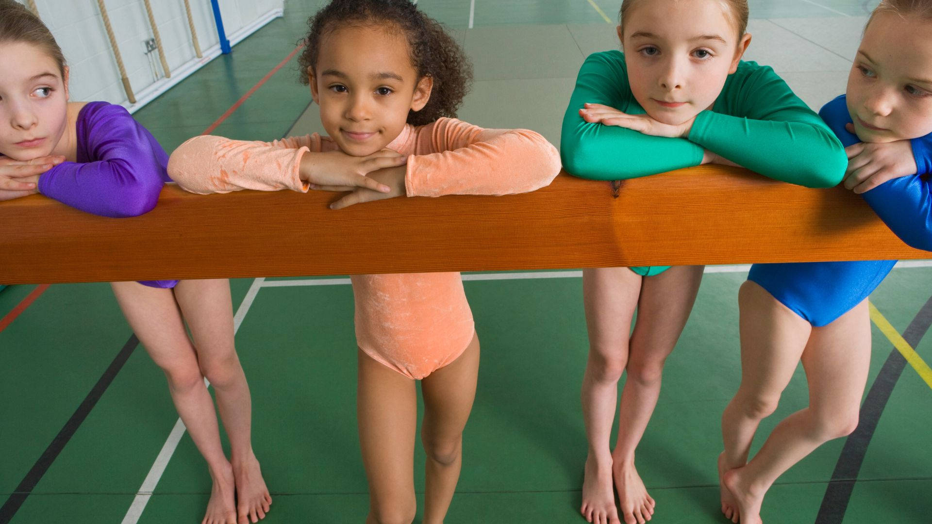 Aspiring Kids Gymnasts Balance Beam Wallpaper