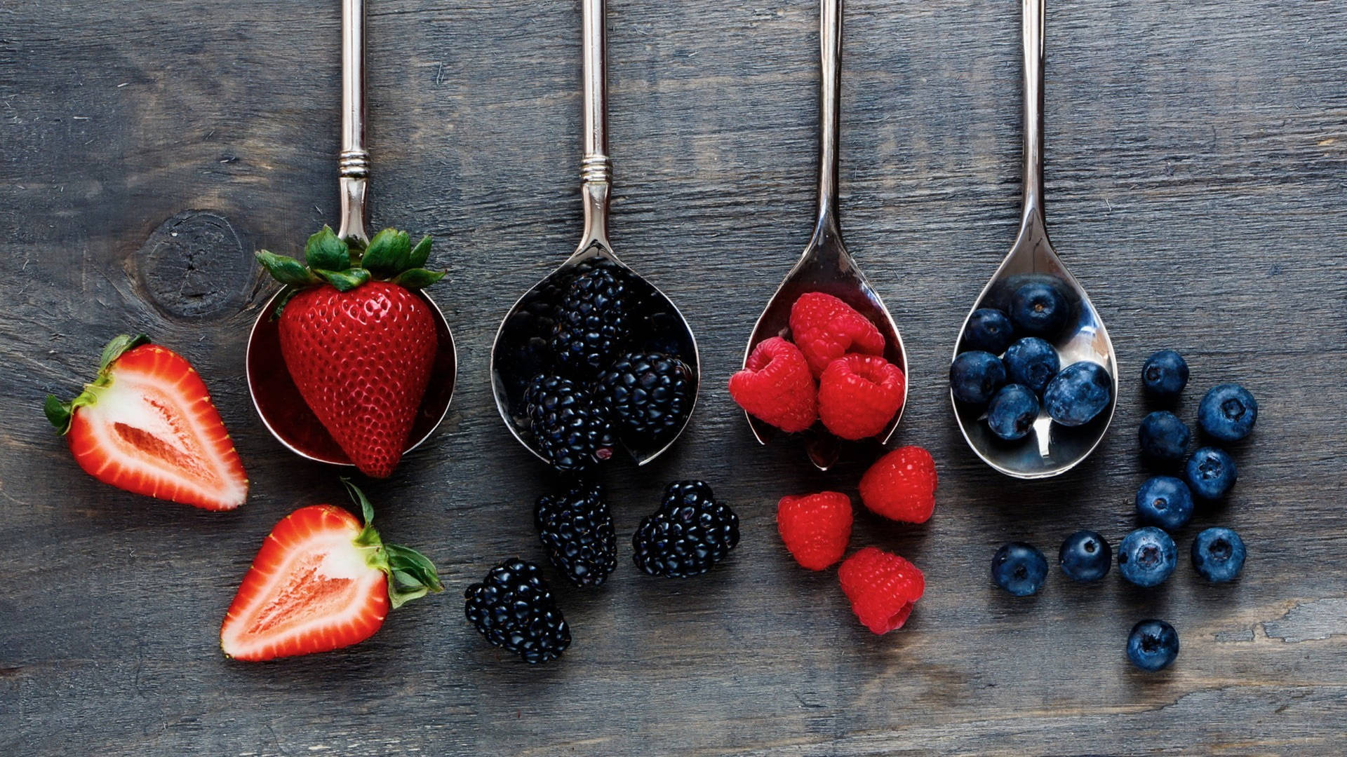 Assorted Berries On Spoons Wallpaper