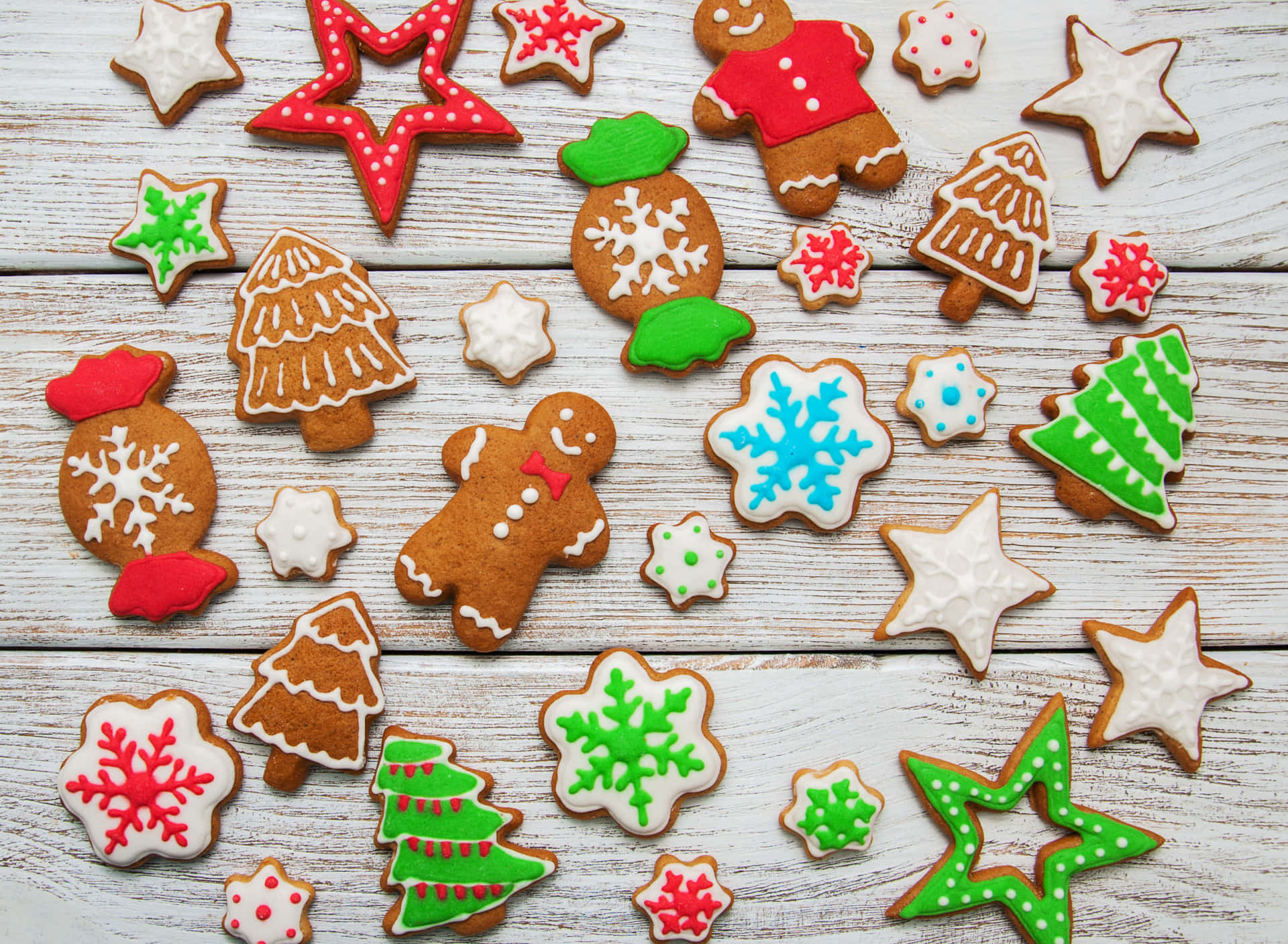 Assorted Christmas Cookieson Wooden Background Wallpaper