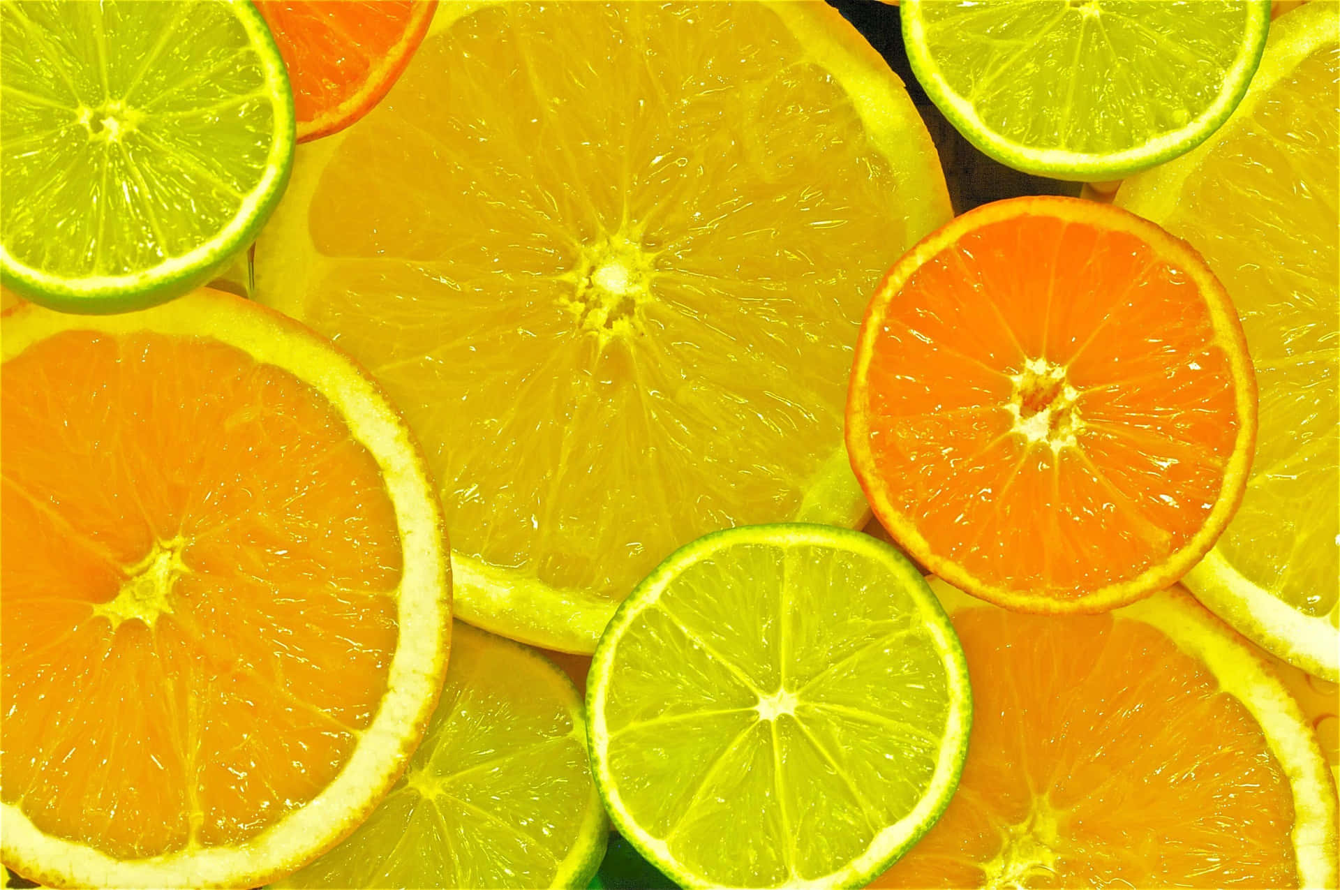 Assorted Citrus Slices Background Wallpaper