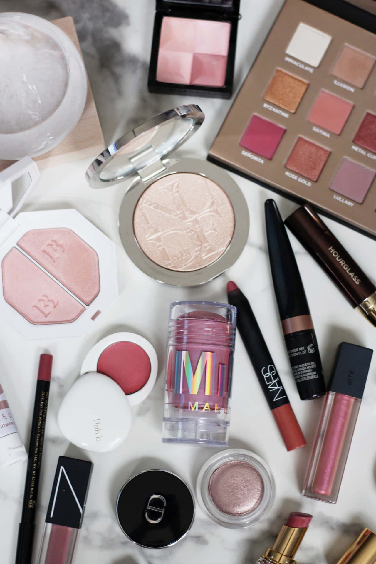 Assorted Makeup Products Flatlay Wallpaper