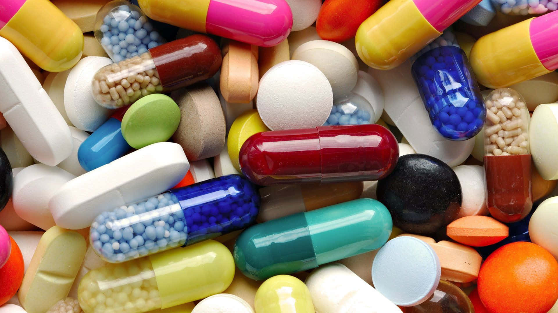 A Variety of Assorted Medication Capsules and Tablets Wallpaper