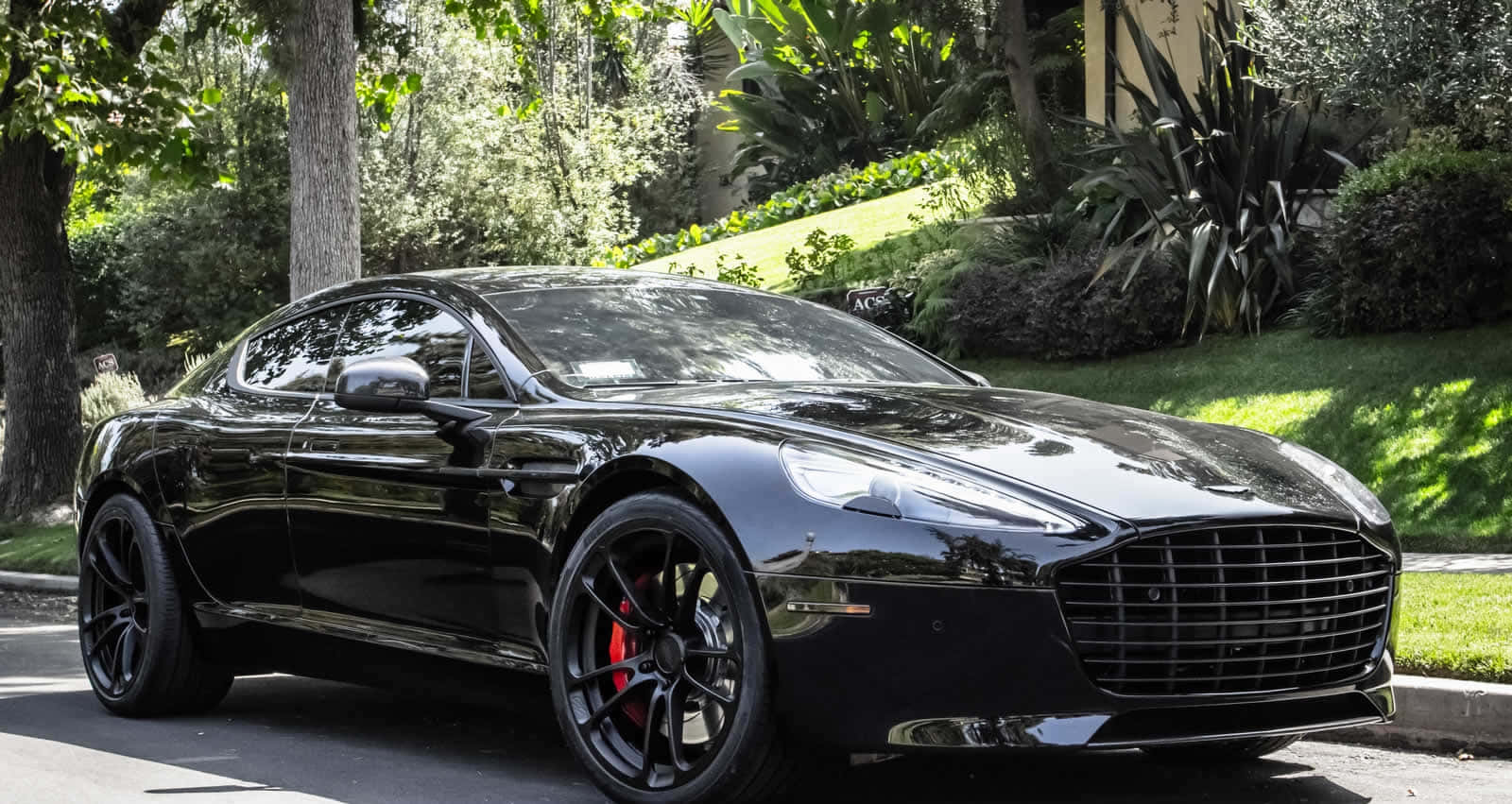 A Stunning Aston Martin Rapide S in Action Wallpaper