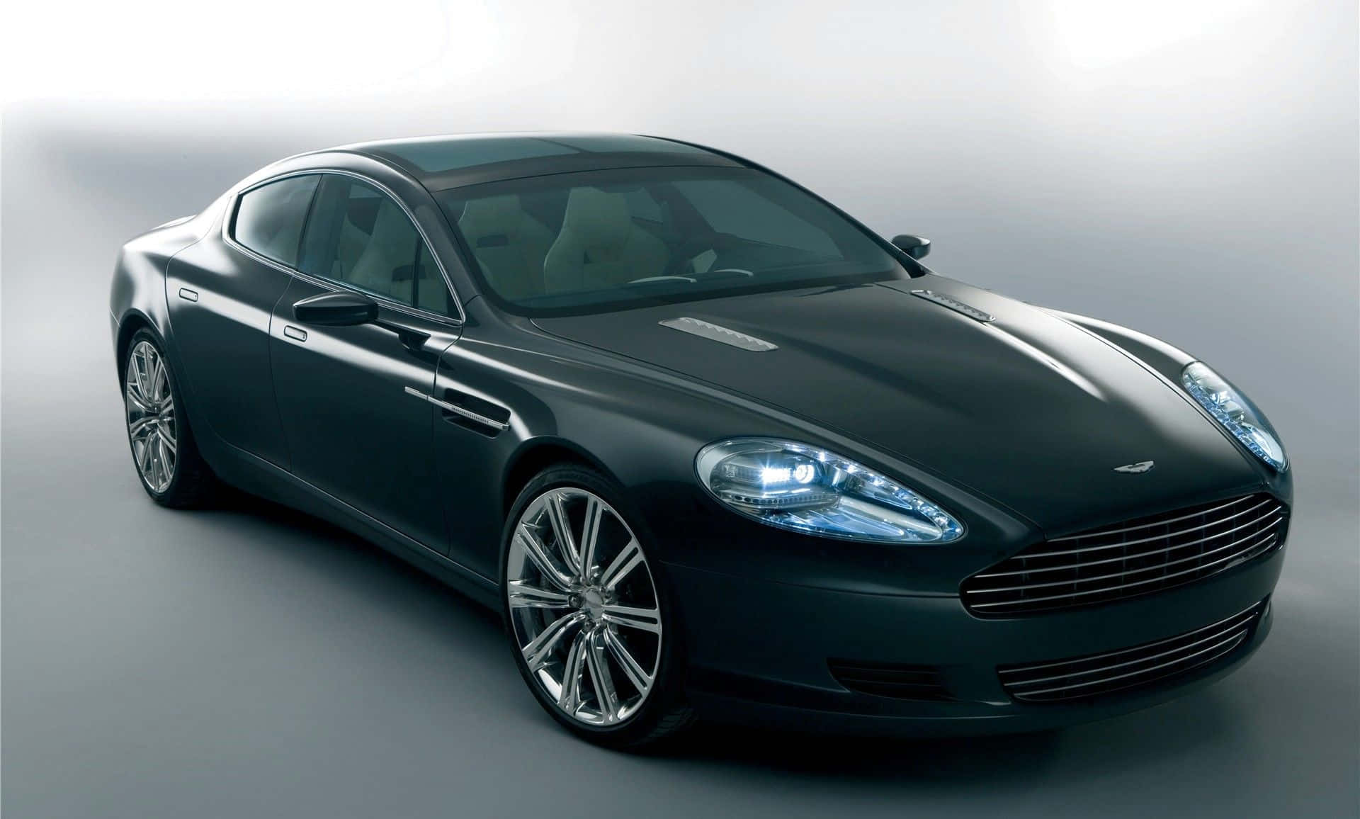 Aston Martin Rapide S on a Breathtaking Road Wallpaper