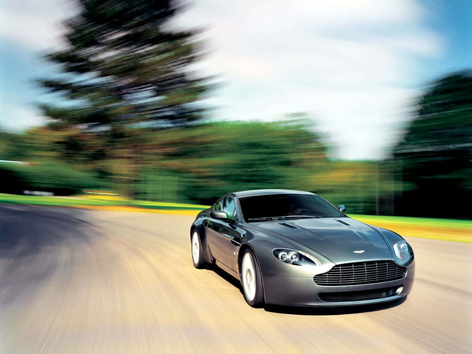 Elegant Aston Martin V12 Vantage on the road Wallpaper