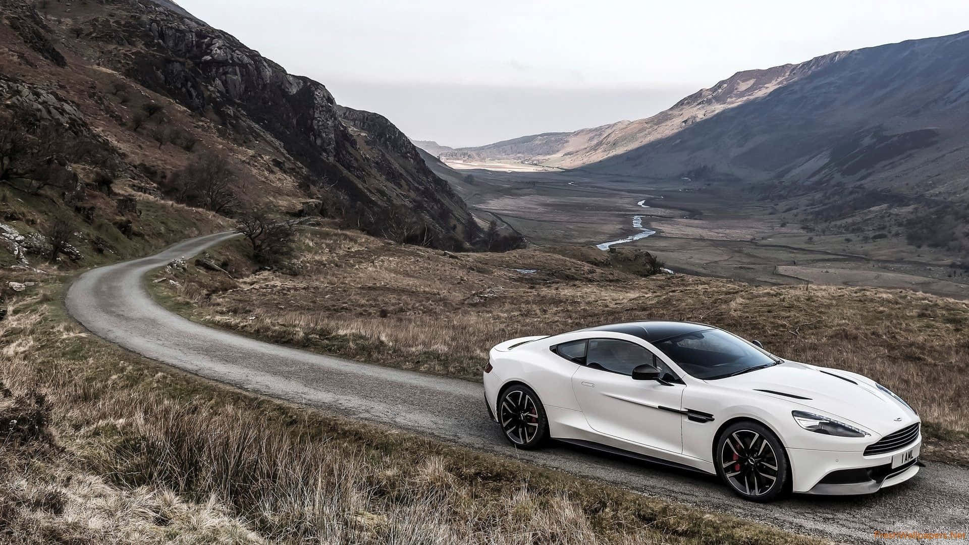 Captivating Aston Martin Vanquish in a Stunning Landscape Wallpaper