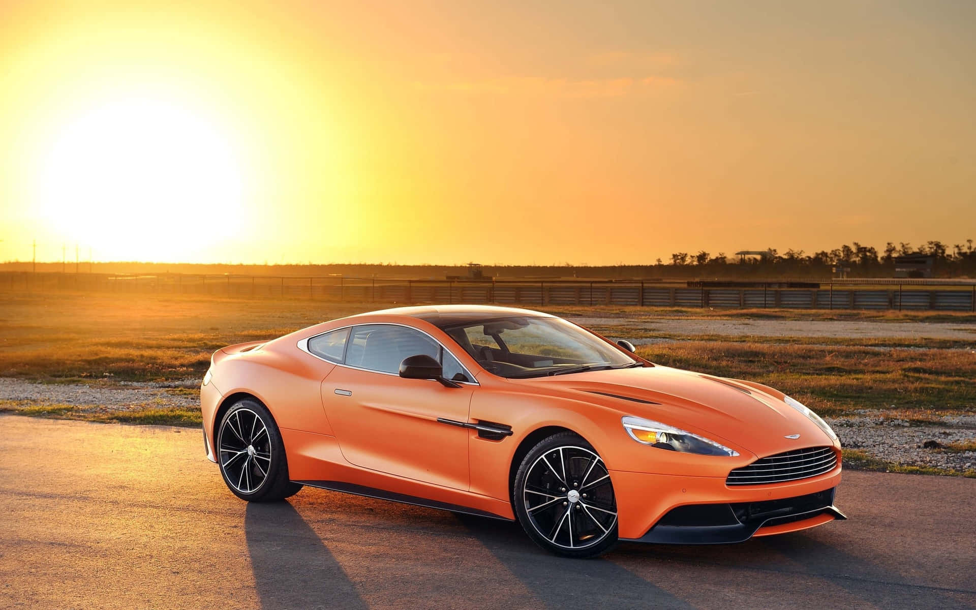 Sleek Aston Martin Vanquish in motion Wallpaper