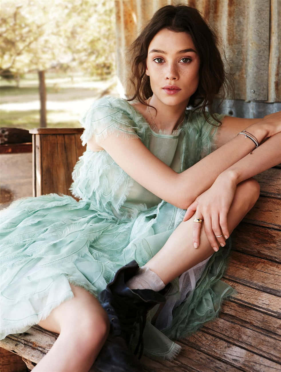 Astrid Berges-Frisbey posing confidently in a stylish outfit Wallpaper