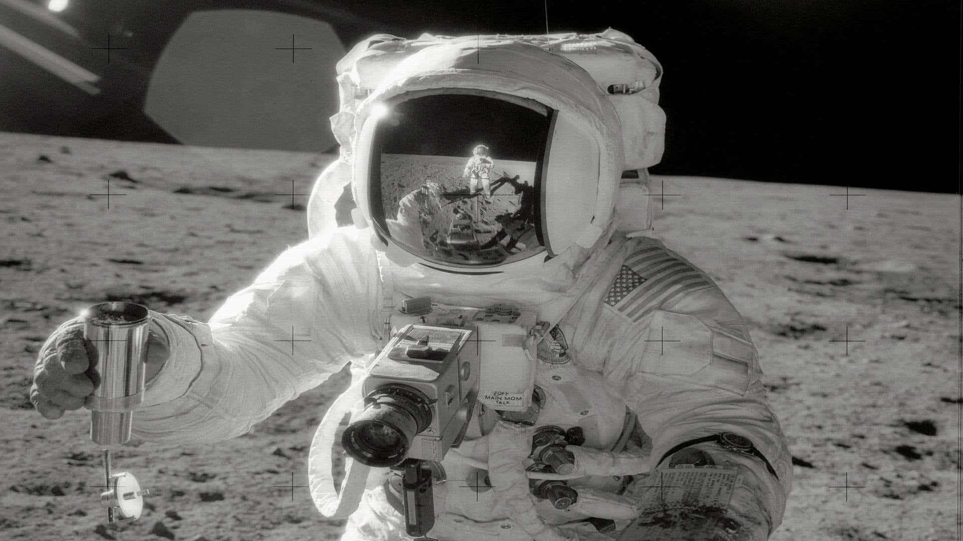 Astronaut_ Moonwalk_ Reflection Wallpaper
