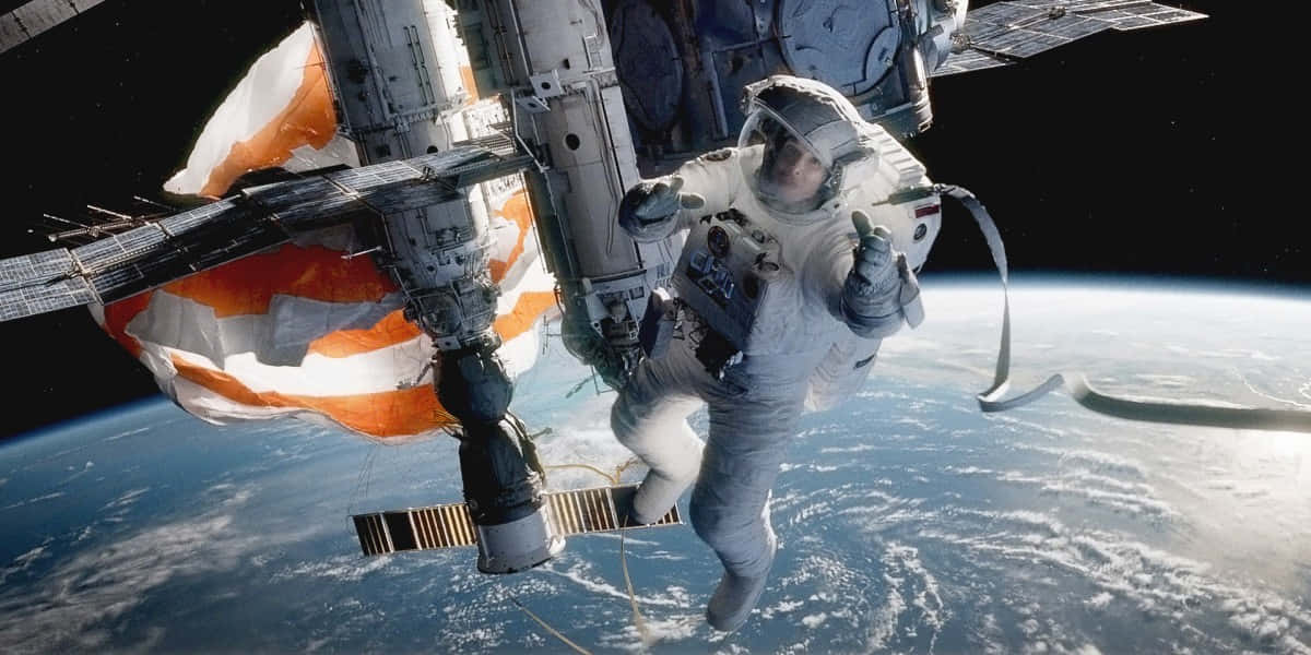 Astronaut Spacewalk Earth Backdrop Wallpaper