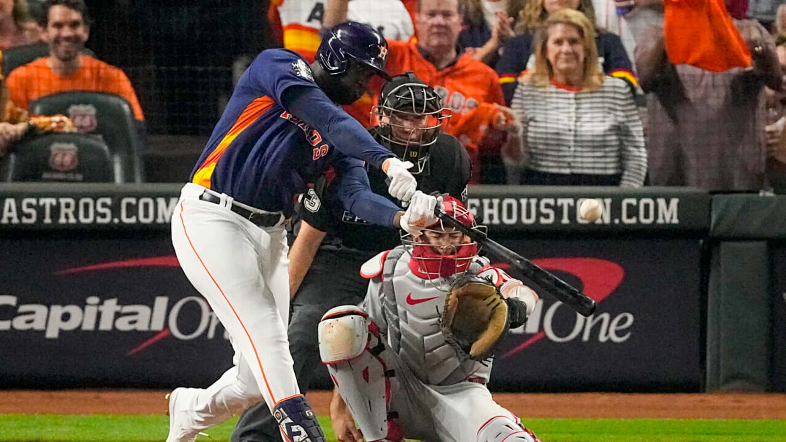 Astros Player Hitting Baseball During Game Wallpaper