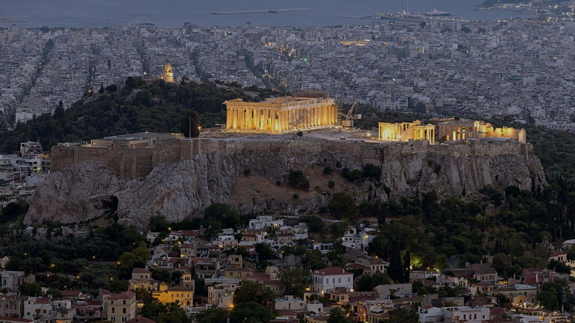 Athenian Acropolis With Yellow Accent Lights Wallpaper