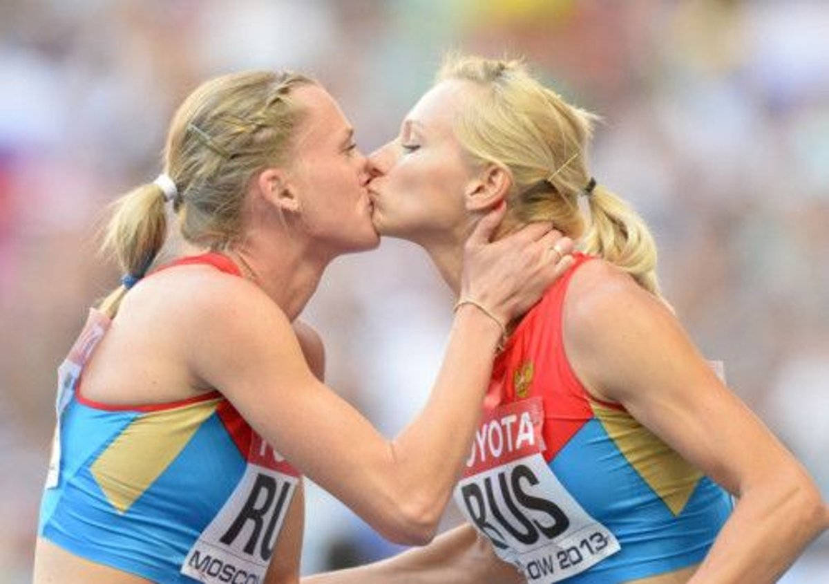 Athlete Girls Kissing Wallpaper