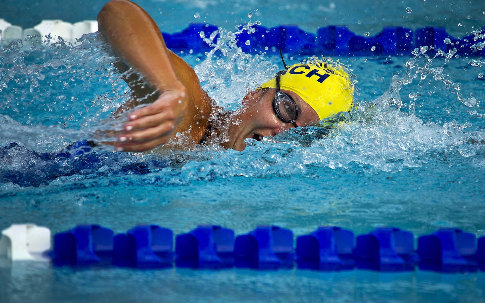 Athlete In Swimming Tournament Wallpaper