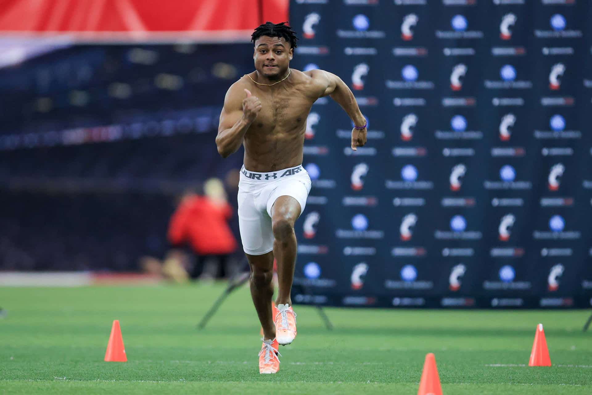 Athlete Sprinting During Combine Event Wallpaper