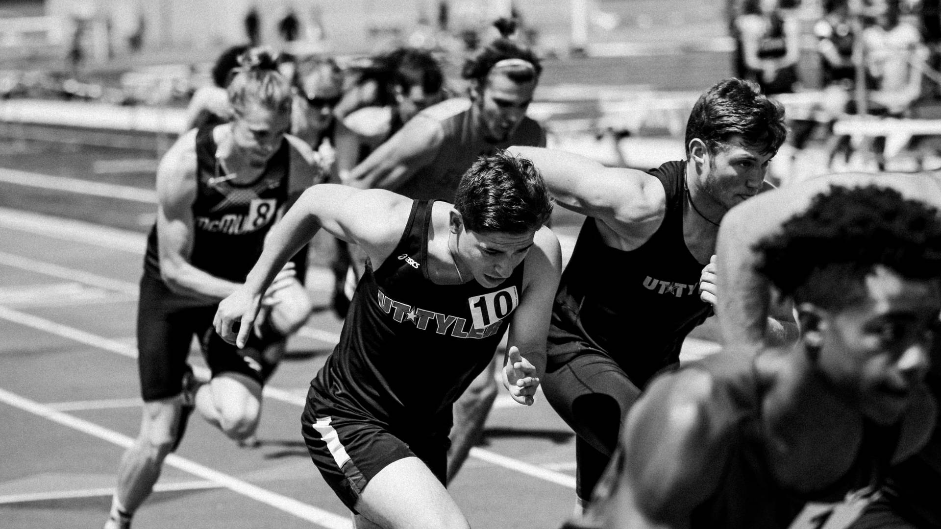 Athletes Running In Track Grayscale