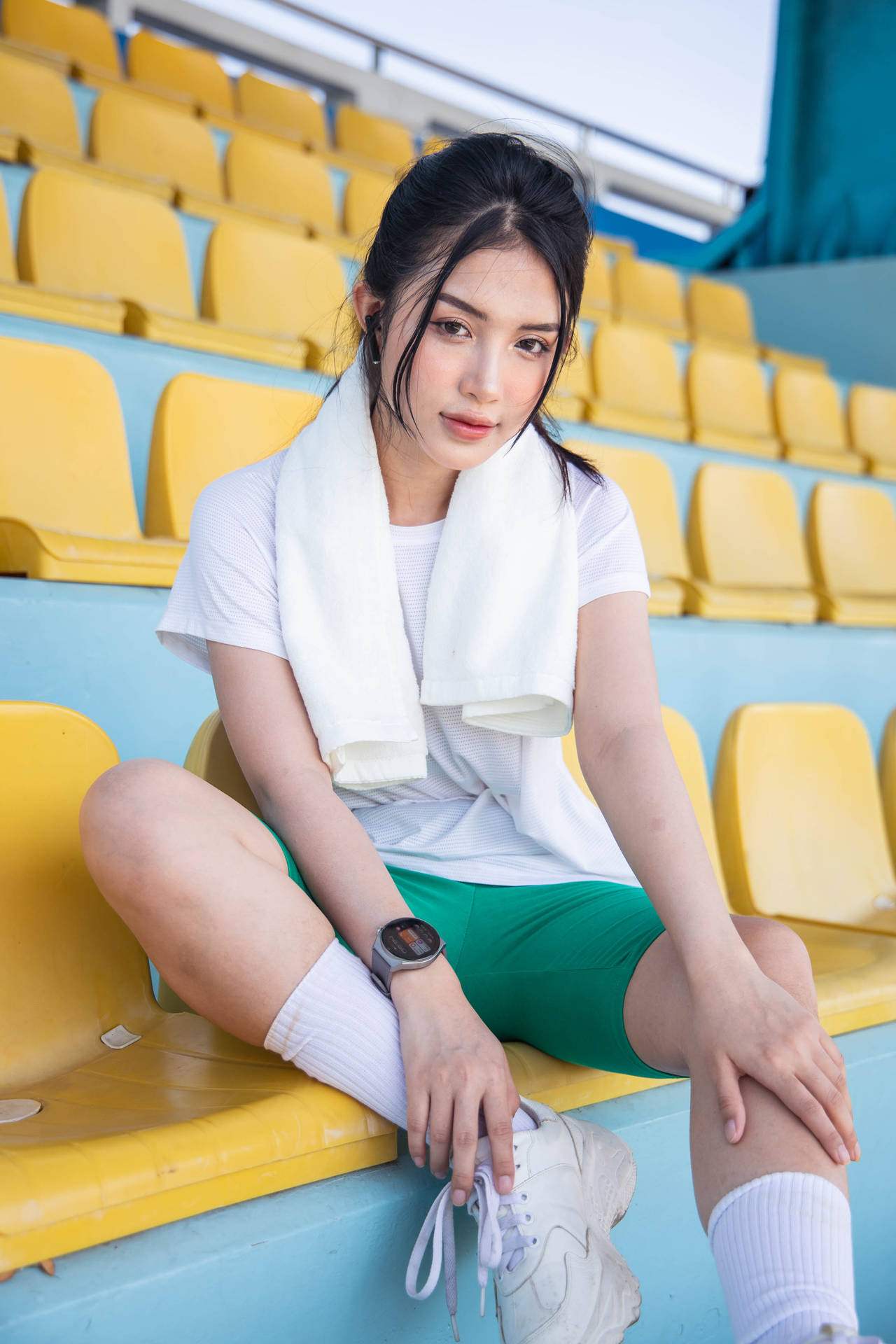 Athletic Woman Wearing Smartwatch Wallpaper