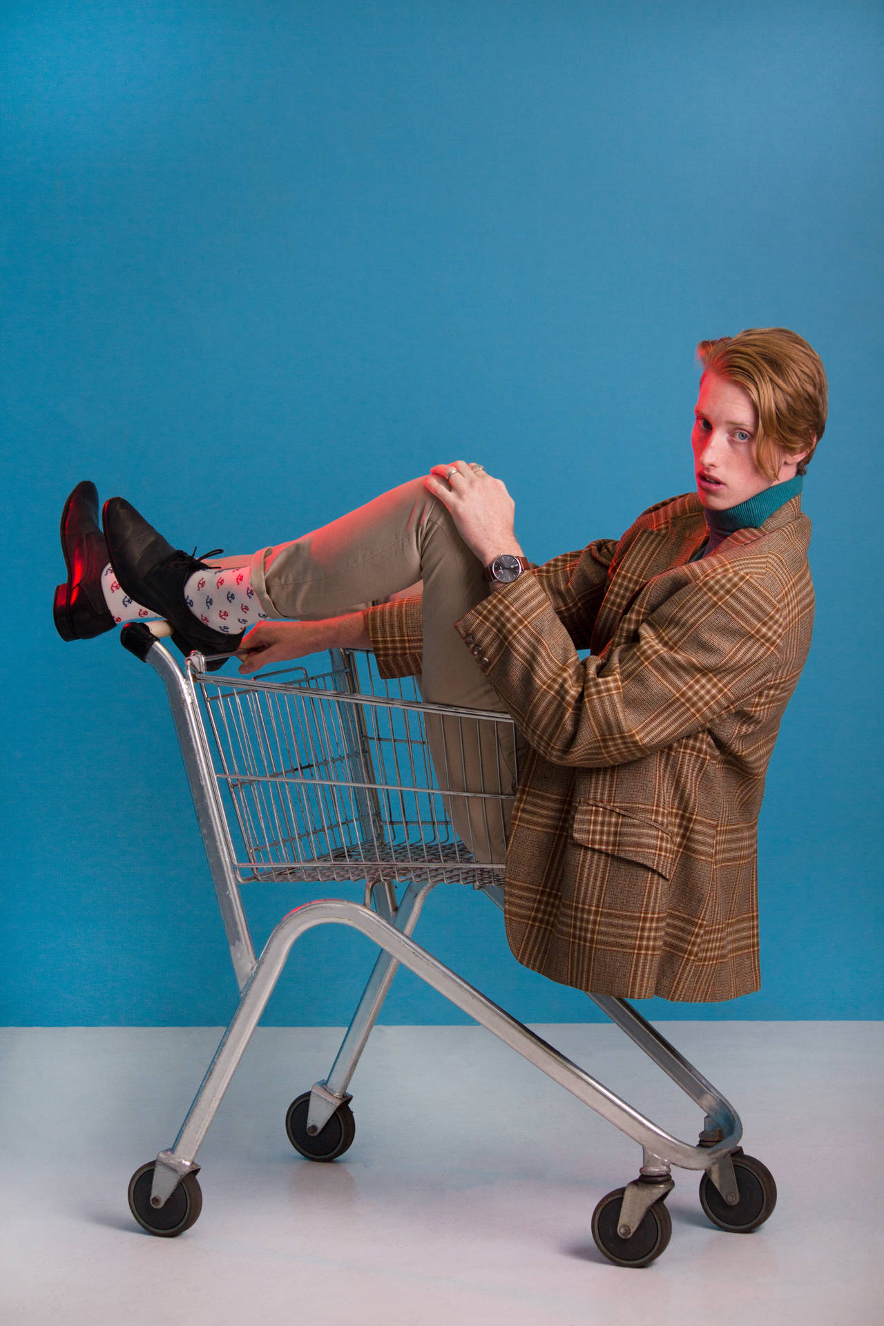 Attitude Boy Riding A Shopping Cart Wallpaper