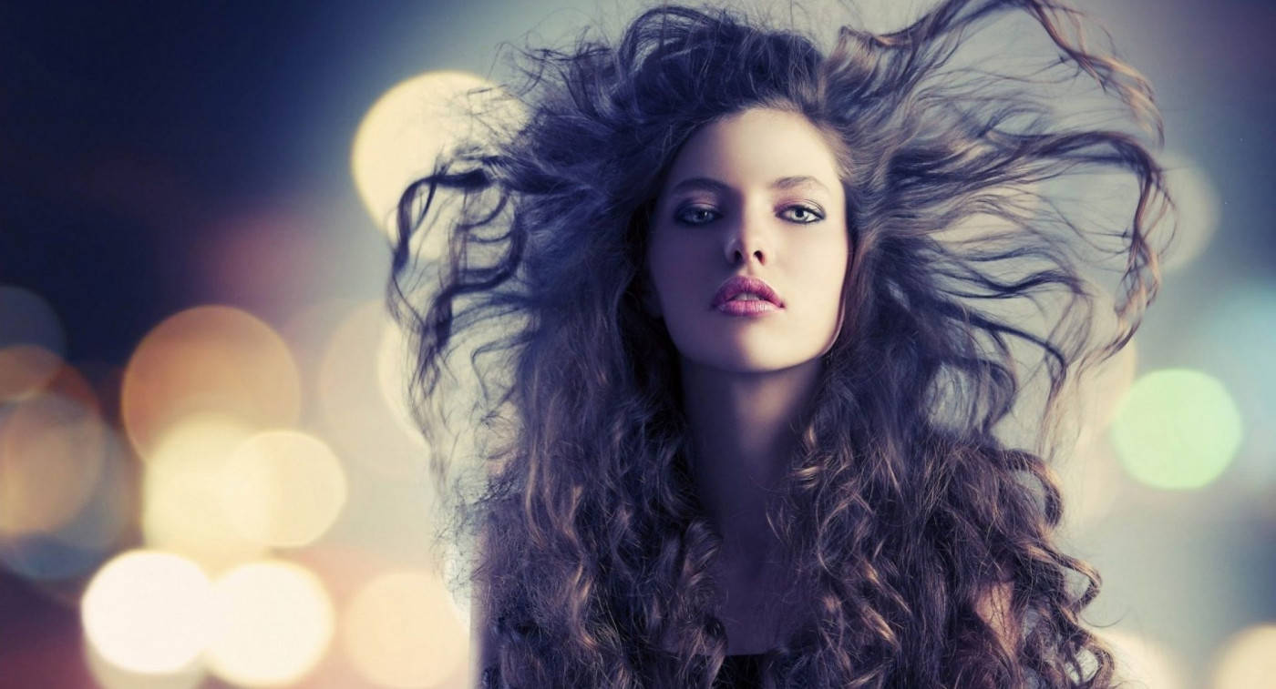 Attitude Girl With Hair Swept By The Wind Background