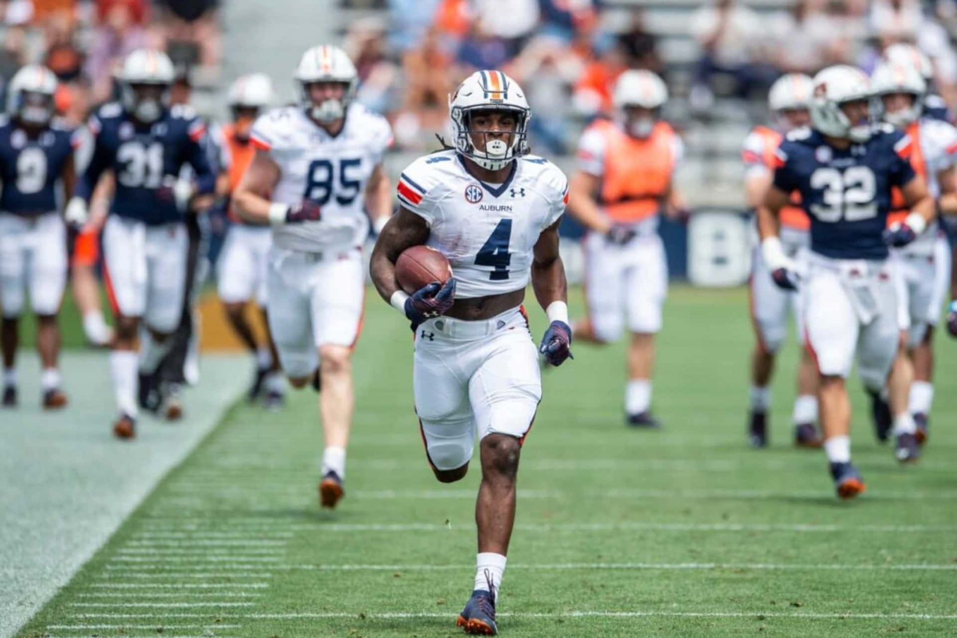 Auburn Football Player Running With Ball Wallpaper