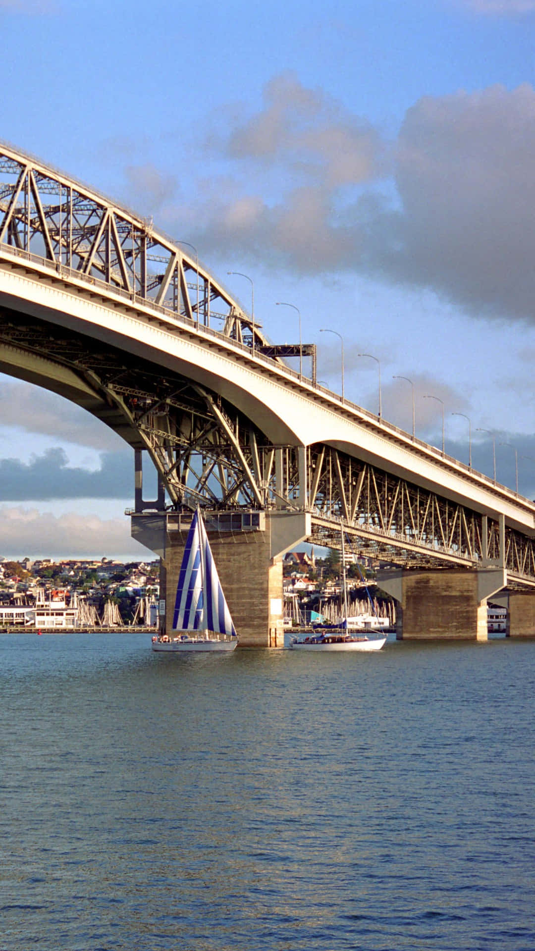 Auckland Harbour Bridgewith Sailboat Wallpaper