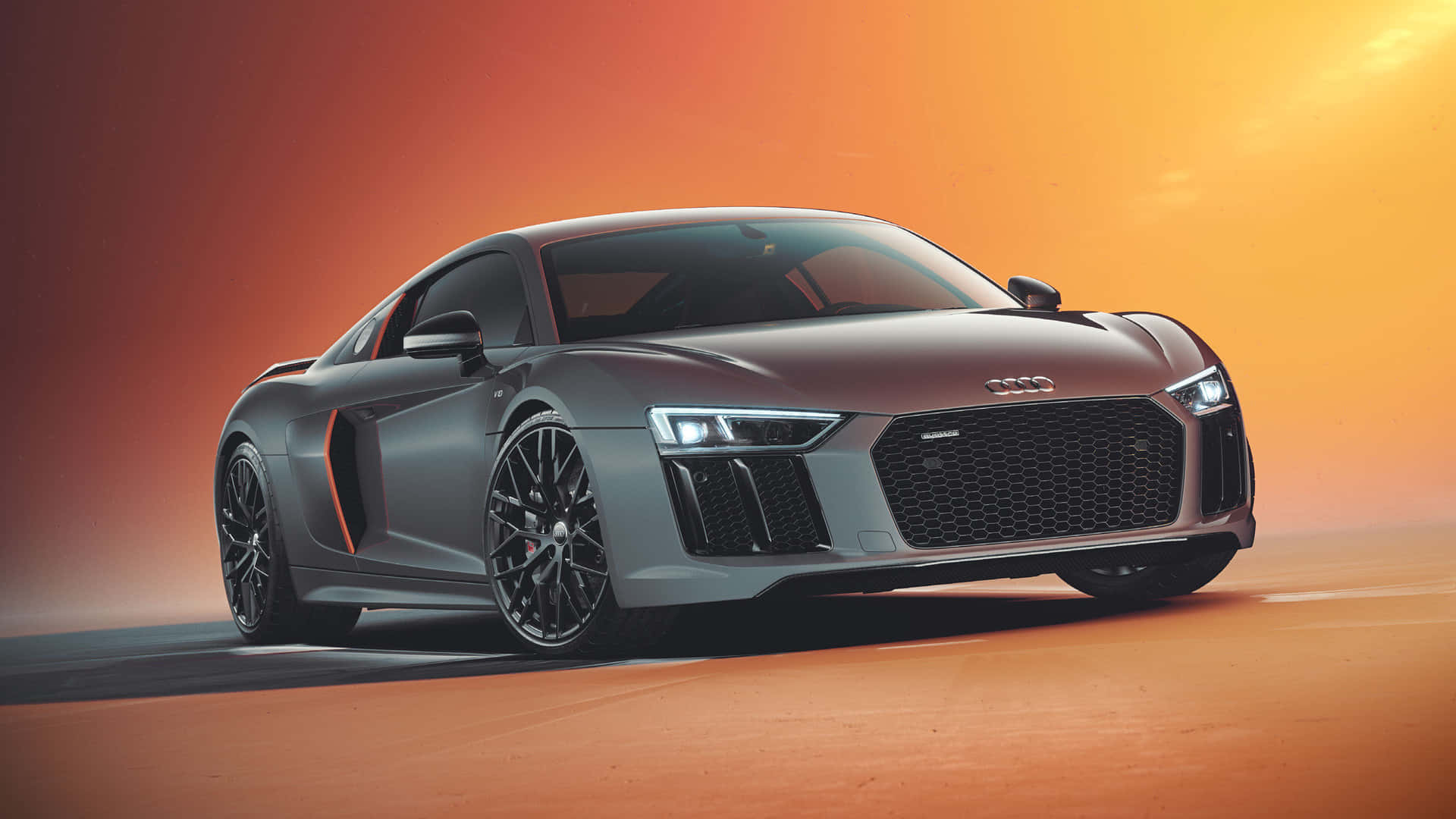 Sleek Audi sports car in motion on a scenic road