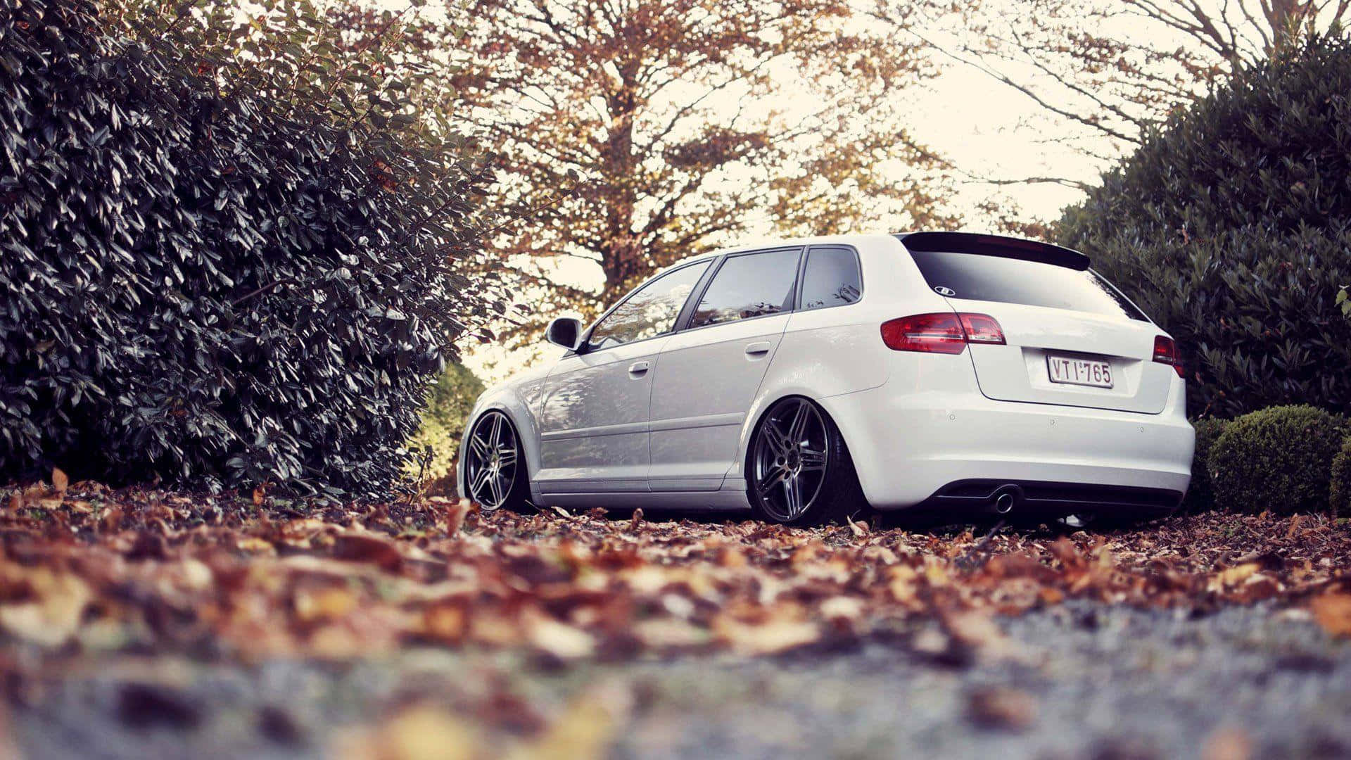 Sleek Audi A3 on Scenic Hilly Road Wallpaper