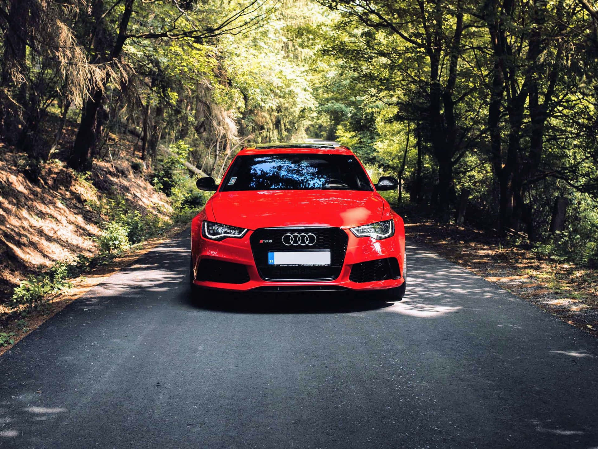 Sleek and sophisticated Audi A3 showcased under dramatic lighting. Wallpaper