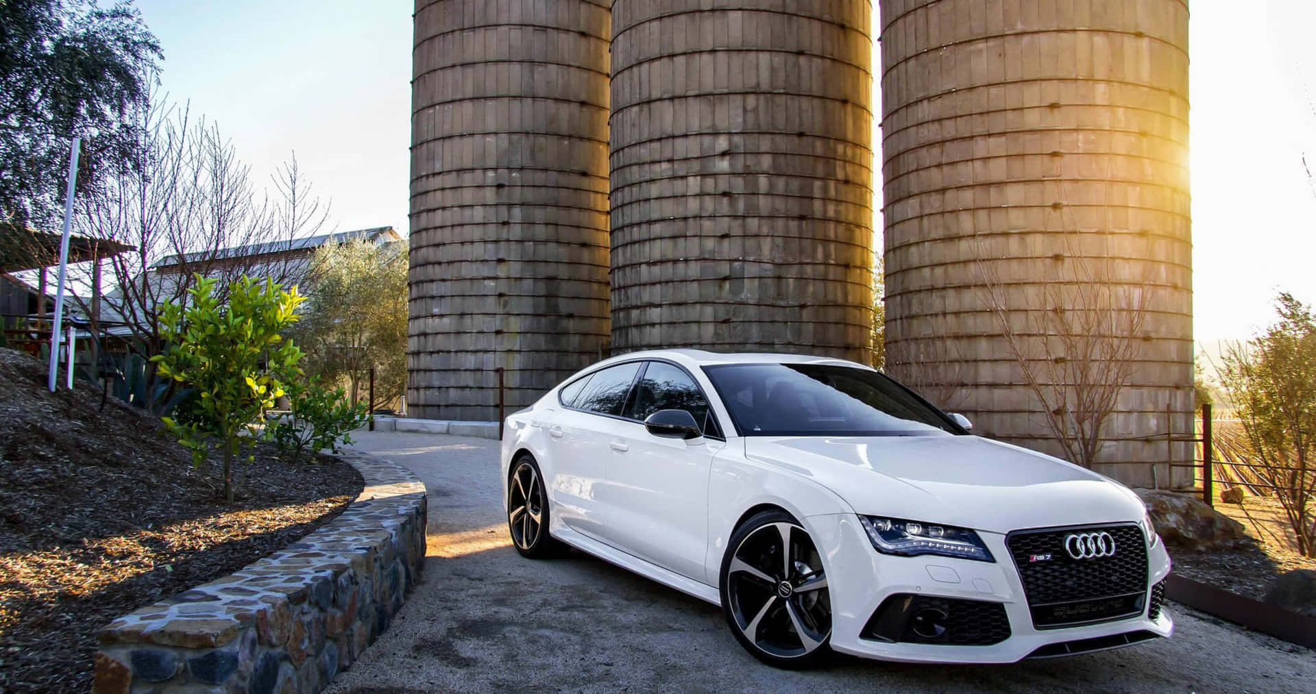 Stunning Audi A4 gliding on an open road Wallpaper